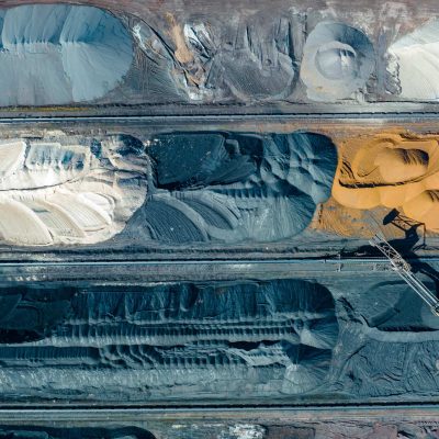 Aerial view of open-pit mining operations illustrating mineral processing and mining process solutions across multiple ore zones.