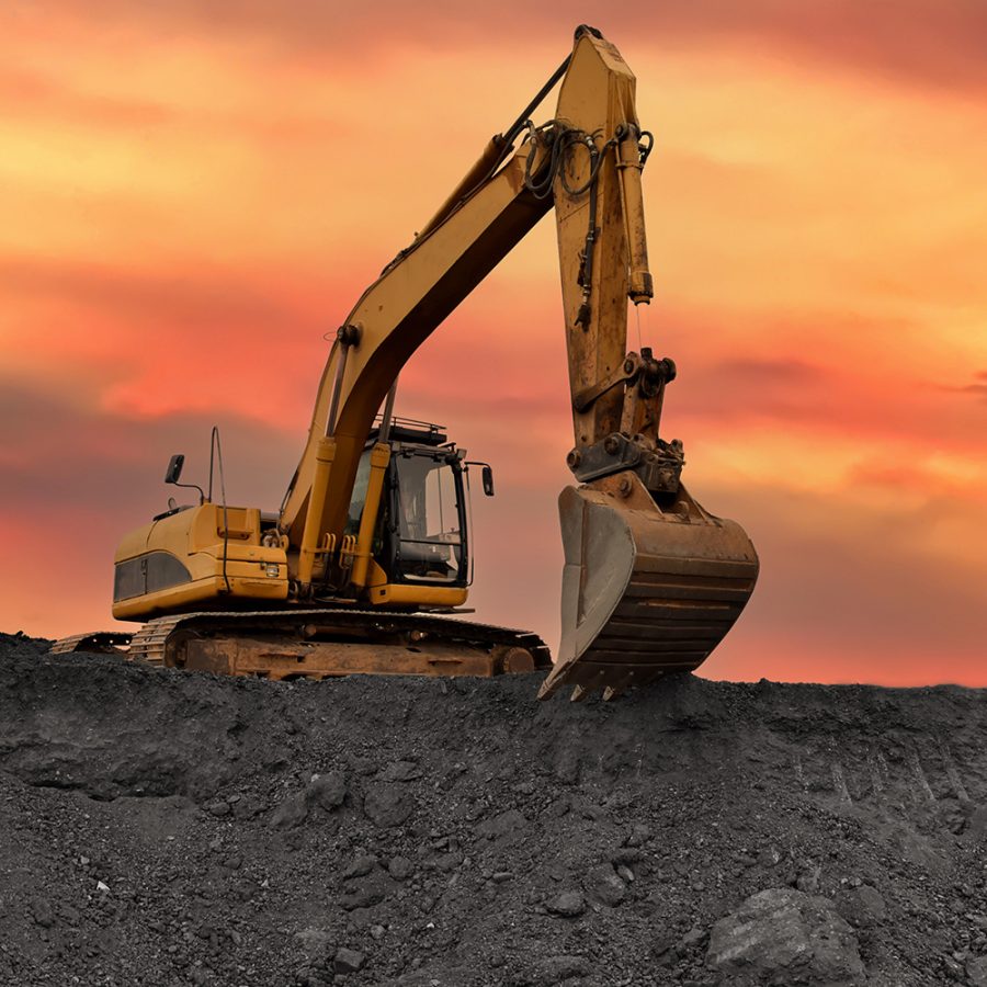 Excavator operating in coal mine illustrating upstream material handling and site-wide operational control.
