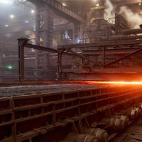 Industrial pyrometallurgy furnace line with molten material during high-temperature metal processing.