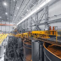 Hydrometallurgy processing plant with leaching and solid-liquid separation equipment in a wet circuit environment.