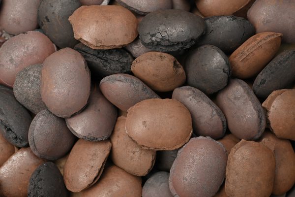 Iron ore pellets produced with organic binder for sustainable agglomeration.