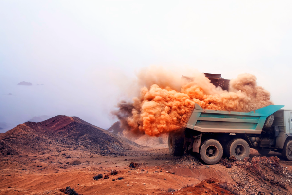 Dust suppression on mining haul road using FLOMIN™ DCA dust control agents.