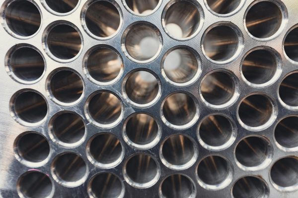 Industrial heat exchanger tubes protected against mineral scale in mining water circuits using FLOSPERSE™.