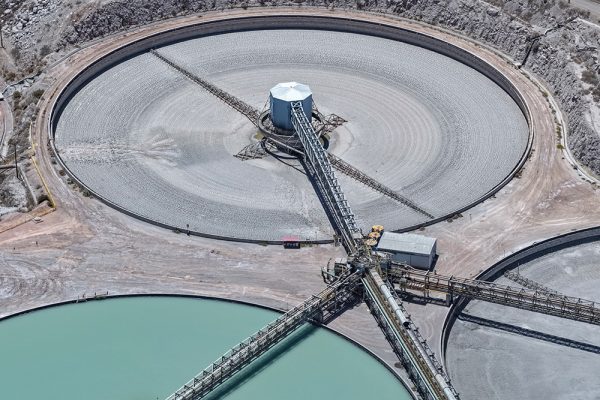 Mining thickener with central rake mechanism for solids settling and water recovery.