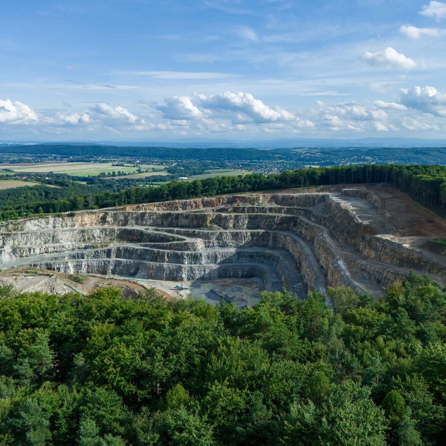 Open-pit mining operation illustrating full mining value chain support from extraction to processing.