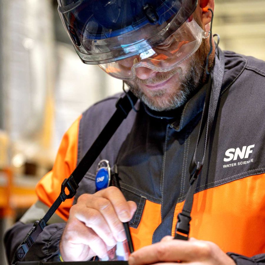 Mining engineer conducting technical validation and process testing at an SNF Technical Center.